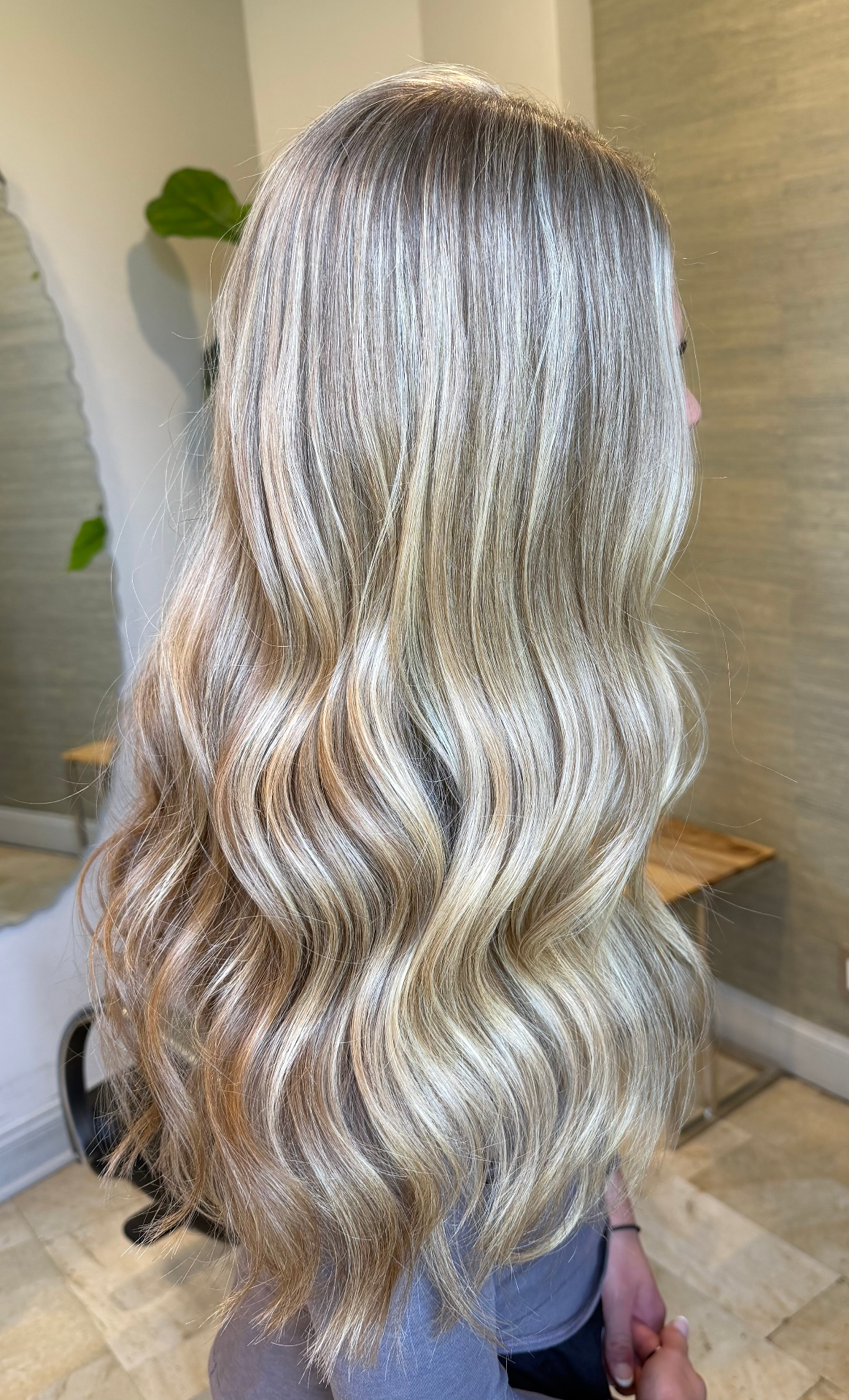 Icy blonde balayage with soft waves